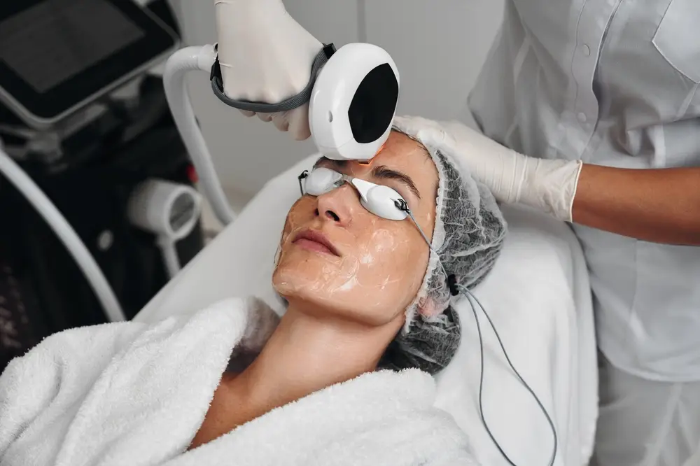 Patient undergoing professional laser treatment for skin rejuvenation